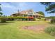 A spacious community clubhouse with a large grassy area and outdoor seating at 6205 Roles Saddle Dr, Rolesville, NC 27571