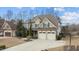 A beautiful two-story home with a two-car garage, manicured lawn, and lovely landscaping at 6205 Roles Saddle Dr, Rolesville, NC 27571