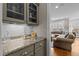 Charming kitchen features granite countertops, subway tile backsplash, and views into living room at 6205 Roles Saddle Dr, Rolesville, NC 27571
