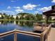 A picturesque lake scene showcasing a dock and the surrounding homes, creating a tranquil neighborhood ambiance at 6205 Roles Saddle Dr, Rolesville, NC 27571