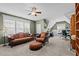 Spacious living room features a cozy sitting area and a well-lit workspace at 6205 Roles Saddle Dr, Rolesville, NC 27571