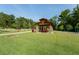 Community park pavilion with stone pillars, picnic tables, and a manicured lawn at 6205 Roles Saddle Dr, Rolesville, NC 27571
