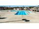 Aerial view of the community pool featuring a large deck, swimming lanes, and splash pad at 6205 Roles Saddle Dr, Rolesville, NC 27571