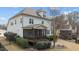 Back exterior elevation showcasing a well-maintained yard and screened porch at 6205 Roles Saddle Dr, Rolesville, NC 27571