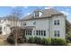 Back exterior elevation showing a well-maintained yard with multiple windows at 6205 Roles Saddle Dr, Rolesville, NC 27571