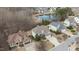 A street view showcasing well-maintained homes with driveways, landscaping, and pond in the background at 6205 Roles Saddle Dr, Rolesville, NC 27571