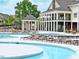 A well-maintained swimming pool with lounge chairs and a covered gazebo with lifeguard at 6205 Roles Saddle Dr, Rolesville, NC 27571