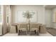 Elegant dining room with a wooden table, six chairs, and soft neutral colors at 704 Shea Hill Dr, Angier, NC 27501