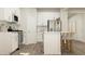 Bright kitchen with stainless steel appliances and white cabinetry at 704 Shea Hill Dr, Angier, NC 27501