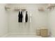 Spacious walk-in closet with shelving, hanging rods, and two storage baskets at 704 Shea Hill Dr, Angier, NC 27501