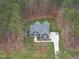 Aerial view of the home surrounded by a tree lined property at 85 Willow Bend Dr, Youngsville, NC 27596