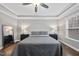 Bedroom features hardwood floors, tray ceiling, and great natural light shining in through a large window at 85 Willow Bend Dr, Youngsville, NC 27596