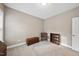 Cozy bedroom featuring carpeted floors, a bookshelf, a wooden chest and a chair at 85 Willow Bend Dr, Youngsville, NC 27596