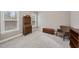 Neutral bedroom with a secretary desk, sitting chair, carpet floors and two windows at 85 Willow Bend Dr, Youngsville, NC 27596