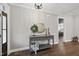 Welcoming entryway with hardwood floors, console table with decorative mirror and wreath at 85 Willow Bend Dr, Youngsville, NC 27596