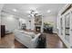 Spacious living room with stone fireplace, hardwood flooring, lots of seating, and ample natural light at 85 Willow Bend Dr, Youngsville, NC 27596
