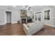Cozy living room featuring a stone fireplace, hardwood floors, and access to the outdoor patio at 85 Willow Bend Dr, Youngsville, NC 27596
