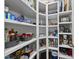 Pantry features organized shelving for ample storage of food, spices, and kitchen accessories at 85 Willow Bend Dr, Youngsville, NC 27596