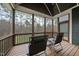 Relaxing screened-in porch with wooden floors, ceiling and a view of the serene, wooded backyard at 85 Willow Bend Dr, Youngsville, NC 27596