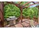 Outdoor wooden deck with a grill and seating area perfect for entertaining guests at 101 Tussled Ivy Way, Cary, NC 27513