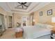 Bedroom showcasing the trey ceiling, neutral walls, and cozy decor at 101 Tussled Ivy Way, Cary, NC 27513