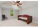 Bright bedroom with a daybed, vaulted ceiling, large window, and neutral decor at 101 Tussled Ivy Way, Cary, NC 27513
