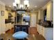 Open kitchen with stainless appliances, large island, and ample storage space at 101 Tussled Ivy Way, Cary, NC 27513