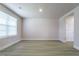 Spacious bedroom with a large window, neutral walls, and wood-look vinyl flooring at 102 Wilderness Ct, Mebane, NC 27302