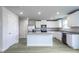 Open kitchen featuring granite counters, stainless steel appliances, and wood-look floors at 102 Wilderness Ct, Mebane, NC 27302