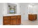Bright bathroom features dual vanities with wood cabinets and a large mirror creating a spacious feel at 1021 Reaves Dr, Chapel Hill, NC 27516