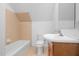 Bathroom featuring a shower and tub combo, toilet, and single sink vanity at 1021 Reaves Dr, Chapel Hill, NC 27516