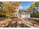 Charming brick home with a three-car garage surrounded by vibrant fall foliage at 1021 Reaves Dr, Chapel Hill, NC 27516