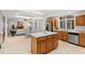 Bright kitchen featuring an island, white countertops and wooden cabinets at 1021 Reaves Dr, Chapel Hill, NC 27516