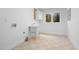 Laundry room featuring a utility sink, window, and laundry hookups at 1021 Reaves Dr, Chapel Hill, NC 27516
