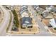 Aerial view of a house with a dark roof and well-kept front lawn, in a residential neighborhood at 1024 Traditions Ridge Dr, Wake Forest, NC 27587