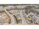 Elevated view of many suburban homes nestled among trees and paved roads, in a well-planned neighborhood at 1024 Traditions Ridge Dr, Wake Forest, NC 27587