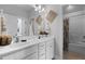 Bright bathroom with double sinks, white cabinets, and neutral walls at 1024 Traditions Ridge Dr, Wake Forest, NC 27587