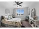 Cozy bedroom with a window, ceiling fan, and stylish furniture at 1024 Traditions Ridge Dr, Wake Forest, NC 27587
