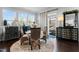 Dining area features natural light from windows and seating for four around a glass table at 1024 Traditions Ridge Dr, Wake Forest, NC 27587
