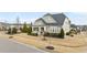 Inviting home displaying a landscaped front yard, a cozy front porch, and traditional exterior elements at 1024 Traditions Ridge Dr, Wake Forest, NC 27587