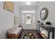 Welcoming foyer featuring a patterned rug, console table, mirror and decorations at 1024 Traditions Ridge Dr, Wake Forest, NC 27587