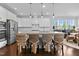 Bright eat-in kitchen boasts granite counters, island seating, and stainless appliances at 1024 Traditions Ridge Dr, Wake Forest, NC 27587