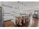 Bright eat-in kitchen boasts granite counters, an island with seating, and pendant lighting at 1024 Traditions Ridge Dr, Wake Forest, NC 27587