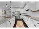 Eat-in kitchen boasts white cabinets, granite countertops, and stainless appliances at 1024 Traditions Ridge Dr, Wake Forest, NC 27587