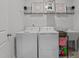 Clean laundry room with modern appliances, a sink, and shelving for storage at 1024 Traditions Ridge Dr, Wake Forest, NC 27587