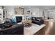 Inviting living room features a fireplace, neutral paint, and comfortable leather furniture at 1024 Traditions Ridge Dr, Wake Forest, NC 27587