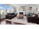 Inviting living room features a fireplace, neutral paint, and lots of natural light at 1024 Traditions Ridge Dr, Wake Forest, NC 27587