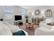 Bright living room features neutral tones, stylish decor, and lots of natural light at 1024 Traditions Ridge Dr, Wake Forest, NC 27587