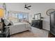 Main bedroom features neutral walls, black furniture, and lots of natural light at 1024 Traditions Ridge Dr, Wake Forest, NC 27587