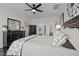 Comfortable main bedroom with modern ceiling fan, ensuite, and decorative pillows at 1024 Traditions Ridge Dr, Wake Forest, NC 27587